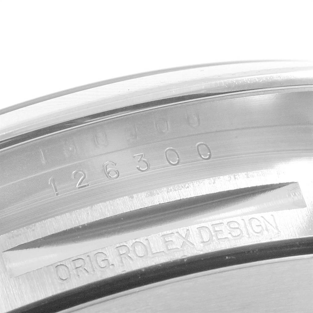 This image shows a close-up of the model and design engravings inside the bezel of a Rolex Datejust 41 126300 Men's Stainless Steel White Dial 126300 Men's Stainless Steel White Dial watch.