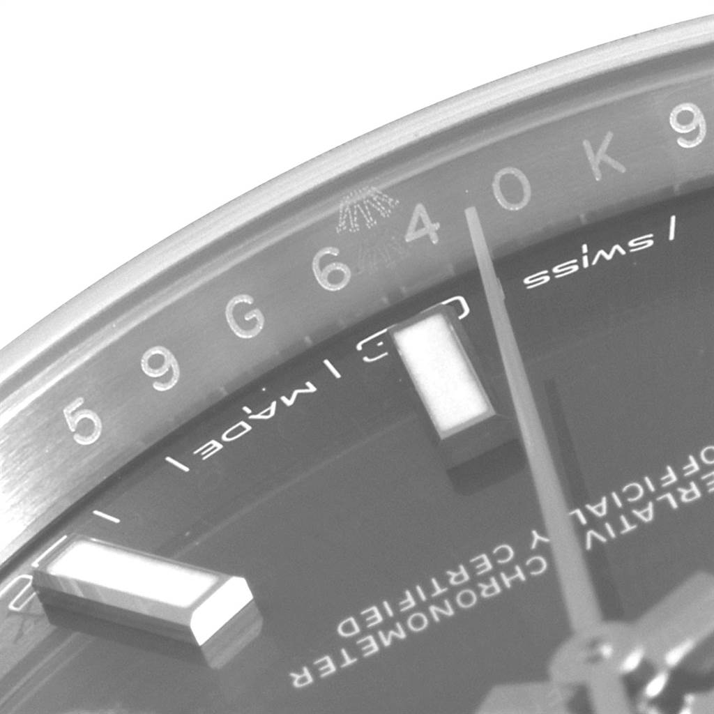 This is a close-up of the dial and part of the bezel on a Rolex Datejust 41 126300 Men
s Stainless Steel Grey Dial 126300 Men
s Stainless Steel Grey Dial watch, showing the hour markers and "Swiss Made" text.