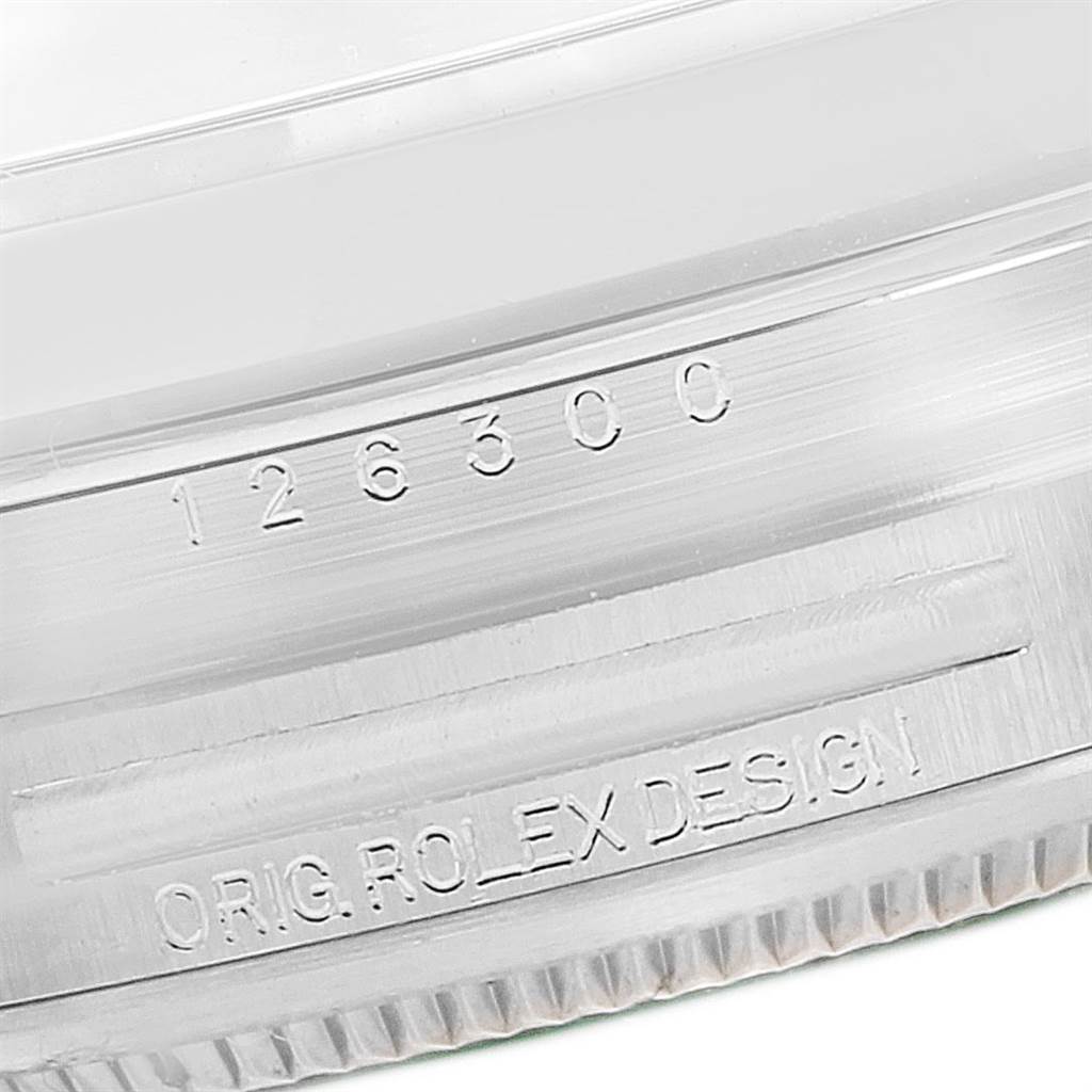 This image shows a close-up of the serial and model number (126300) engraved on the case of a Rolex Datejust 41 126300 Men's Stainless Steel Blue Dial 126300 Men's Stainless Steel Blue Dial watch.