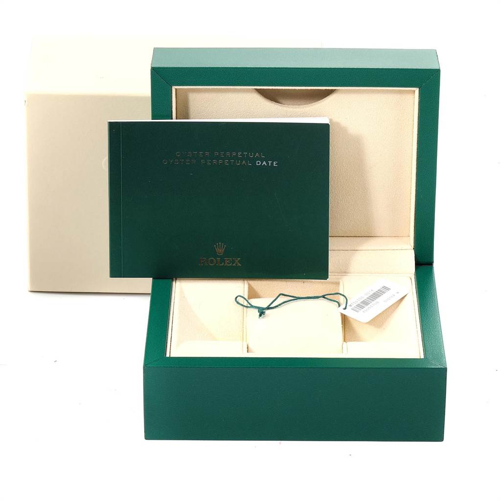 This image shows the packaging, including the original box and manual, for a Rolex Datejust 41 126300 Men's Stainless Steel Blue Dial 126300 Men's Stainless Steel Blue Dial watch.