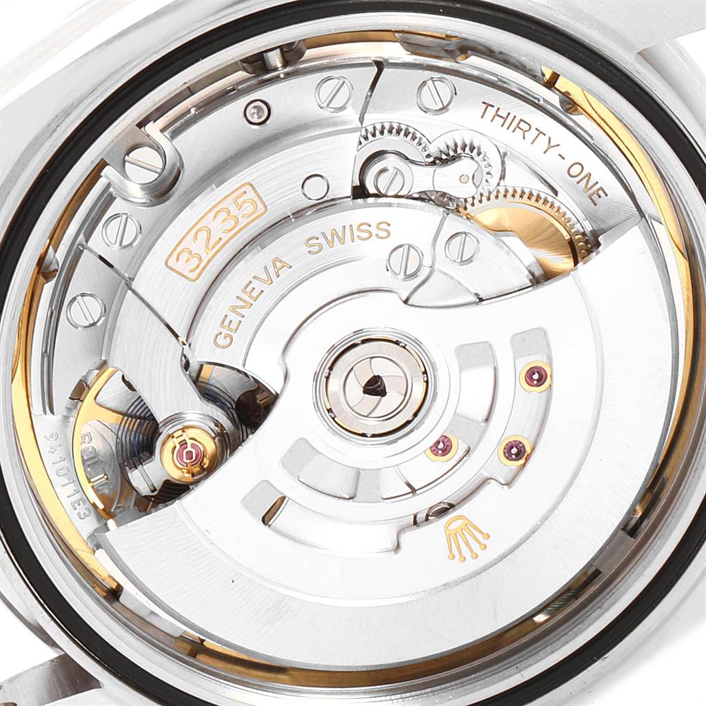 This image shows a close-up of the movement and inner mechanism of the Rolex Datejust 41 126300 Men's Stainless Steel Blue Dial 126300 Men's Stainless Steel Blue Dial watch, featuring the "3235" caliber.