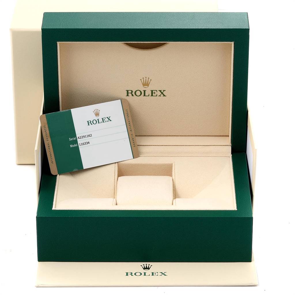 The image shows the Rolex Datejust 41 116334 Men's Stainless Steel Blue Dial 116334 Men's Stainless Steel Blue Dial model's empty green and beige watch box with an authenticity card inside.