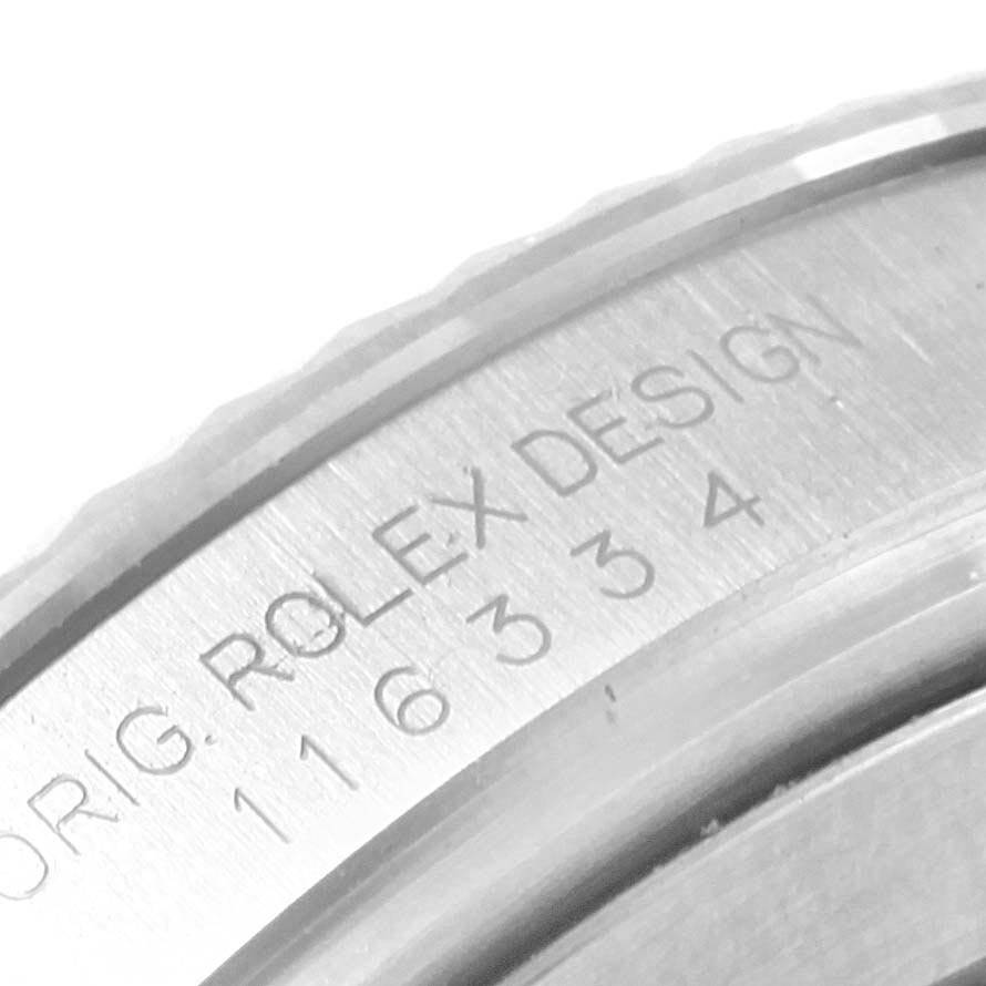 This close-up image shows the engraved text on the side of a Rolex Datejust 41 116334 Men's Stainless Steel Blue Dial 116334 Men's Stainless Steel Blue Dial model watch case.