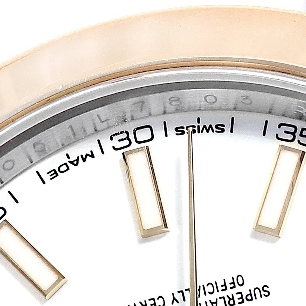 This close-up image of the Rolex Datejust 41 126303 Men's Steel and Gold (two tone) White Dial 126303 Men's Steel and Gold (two tone) White Dial model shows the dial with hour markers, minute markers, and part of the bezel.