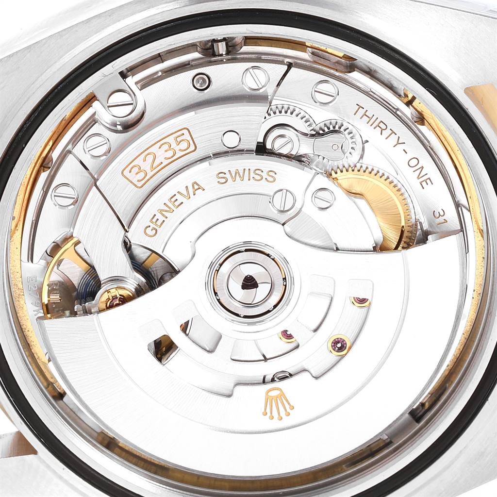 The image shows a close-up of the movement and inner workings of a Rolex Datejust 41 126303 Men's Steel and Gold (two tone) White Dial 126303 Men's Steel and Gold (two tone) White Dial model.