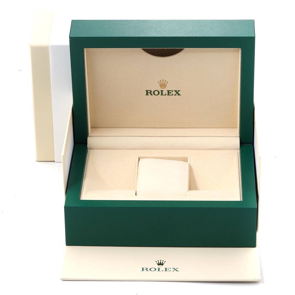 This image shows an open green and beige Rolex Datejust 41 126303 Men's Steel and Gold (two tone) White Dial 126303 Men's Steel and Gold (two tone) White Dial watch box, highlighting its interior compartments.