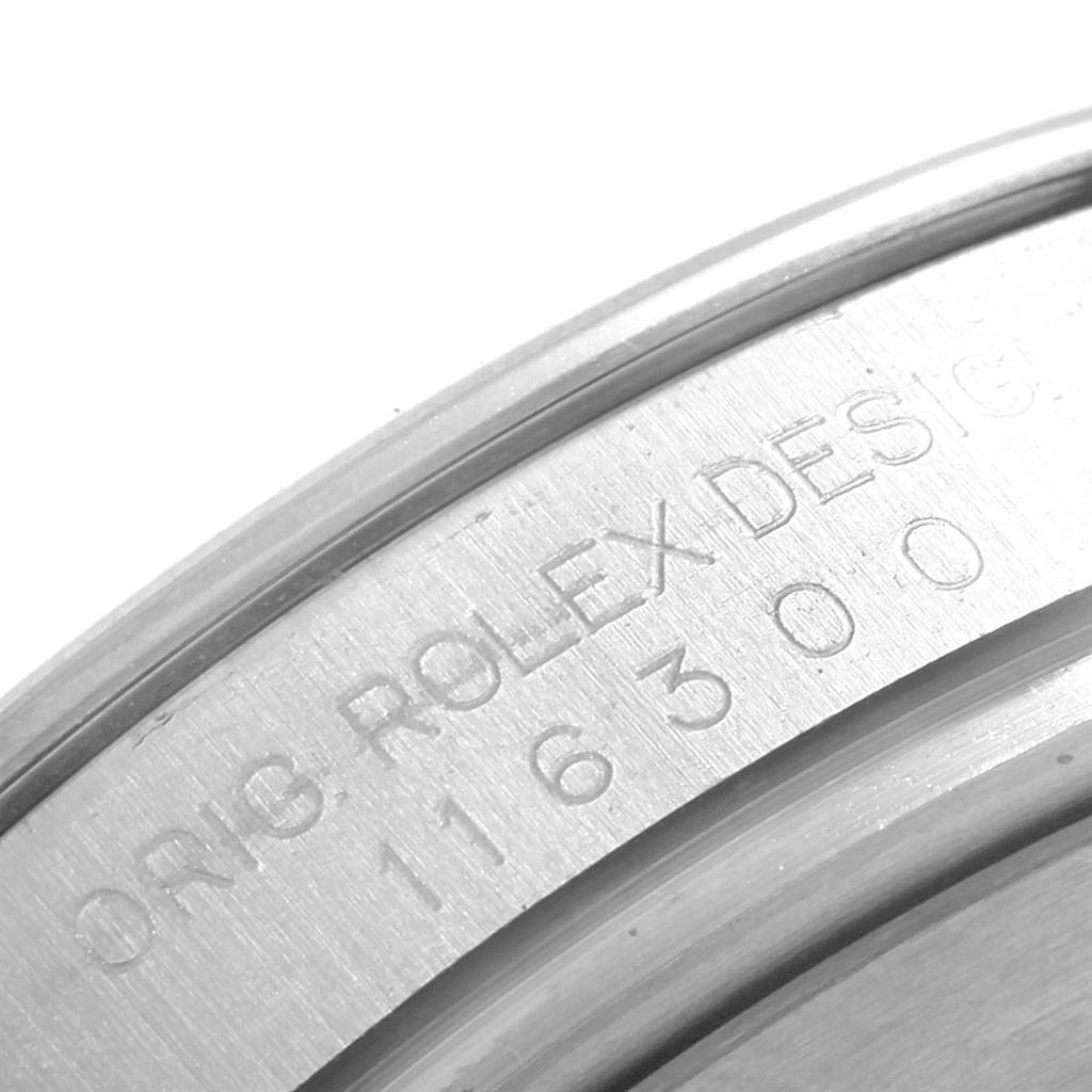 The image shows a close-up of the case engraving on a Rolex Datejust 41 116300 Men
s Stainless Steel Blue Dial 116300 Men
s Stainless Steel Blue Dial watch.