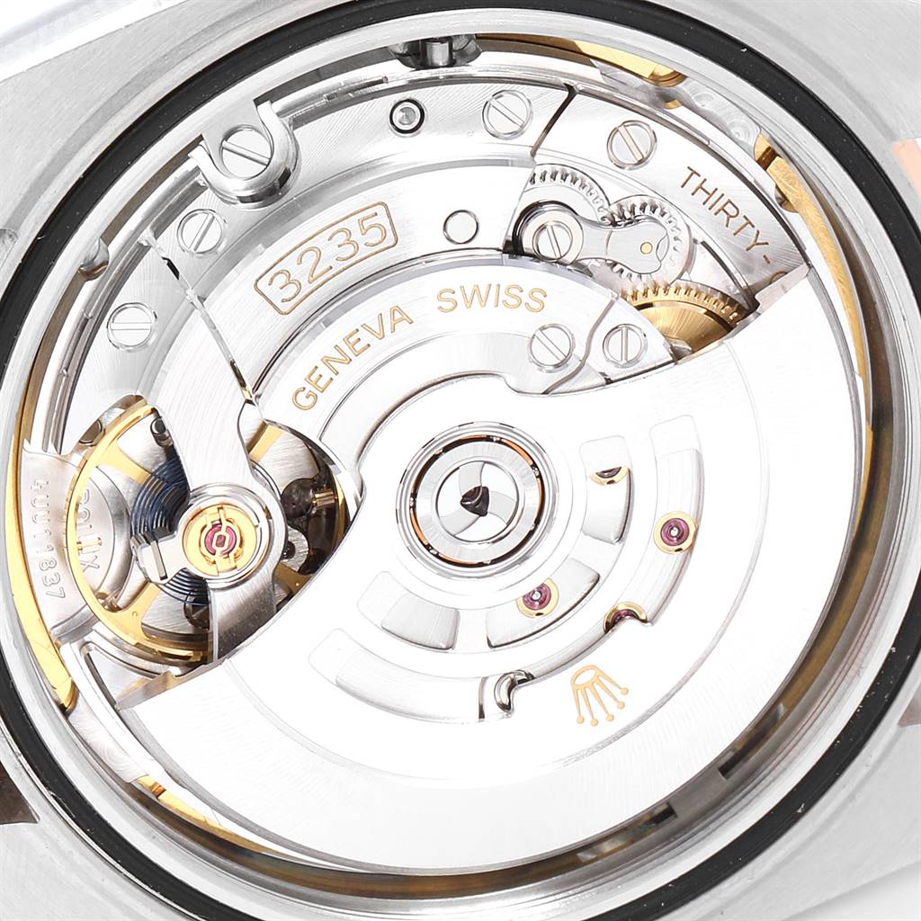 The image shows the internal movement mechanism of the Rolex Datejust 41 126331 Men's Steel and Gold (two tone) Brown Dial 126331 Men's Steel and Gold (two tone) Brown Dial model, including the rotor and gears, from a rear angle.