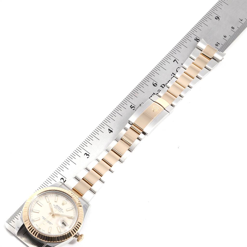 The image shows a top-down view of the Rolex Datejust 41 116333 Men's Steel and Gold (two tone) Silver Dial 116333 Men's Steel and Gold (two tone) Silver Dial watch, including the face, bezel, and part of the bracelet with a ruler for scale.