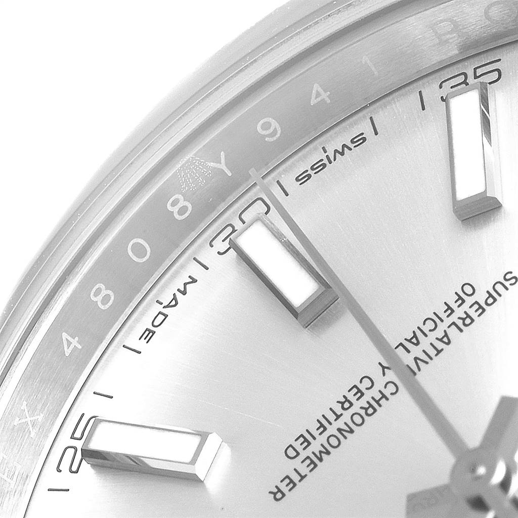 This image shows a close-up of the dial and markers of a Rolex Datejust 41 126300 Men
s Stainless Steel Silver Dial 126300 Men
s Stainless Steel Silver Dial watch, specifically focusing on the minute markers and "Swiss Made" text.