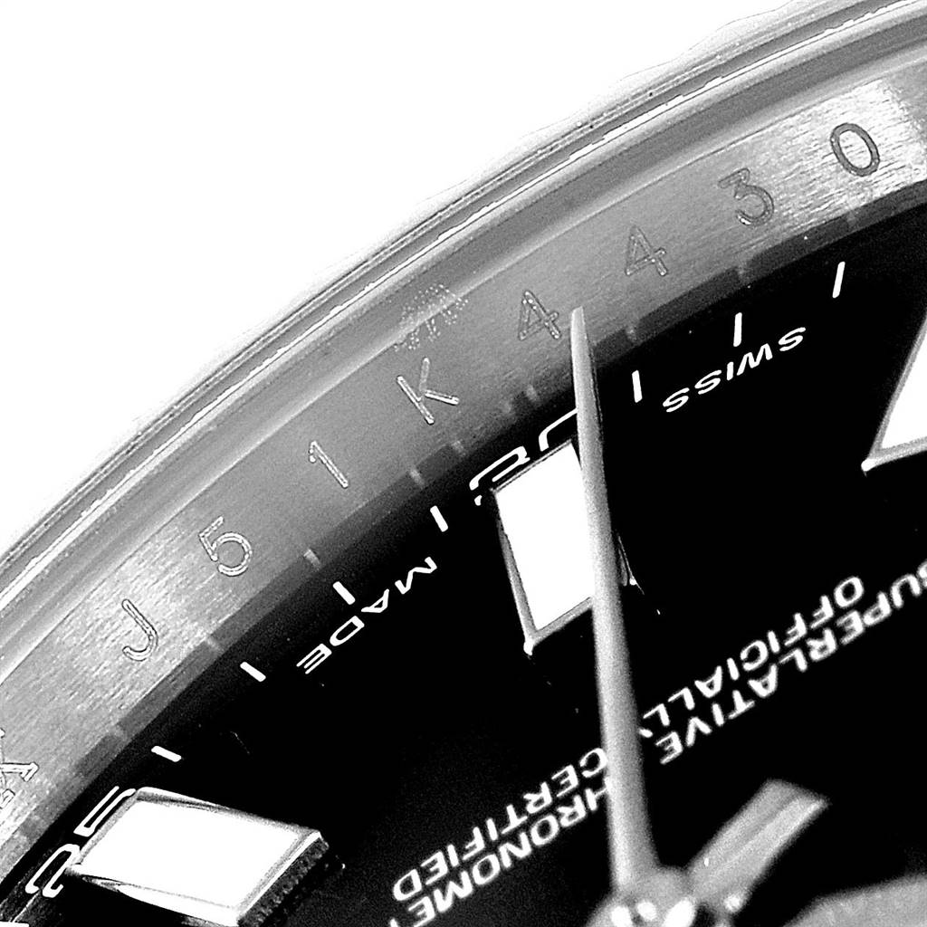 The image shows a close-up of the dial and hour markers of a Rolex Datejust 41 116334 Men's Stainless Steel Black Dial 116334 Men's Stainless Steel Black Dial watch at an angle.