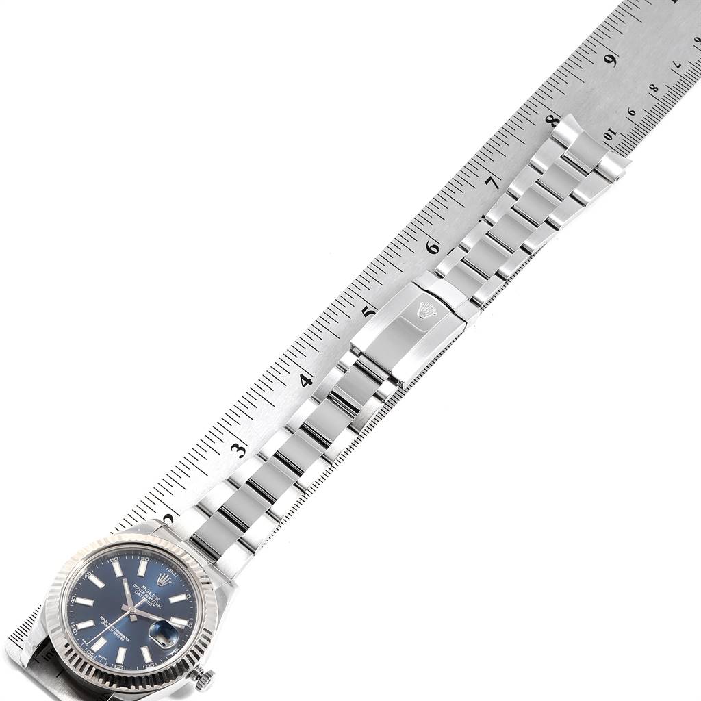 The image shows a Rolex Datejust 41 116334 Men's Stainless Steel White Dial 116334 Men's Stainless Steel White Dial watch laid flat against a ruler, displaying the watch face, bracelet, and clasp.
