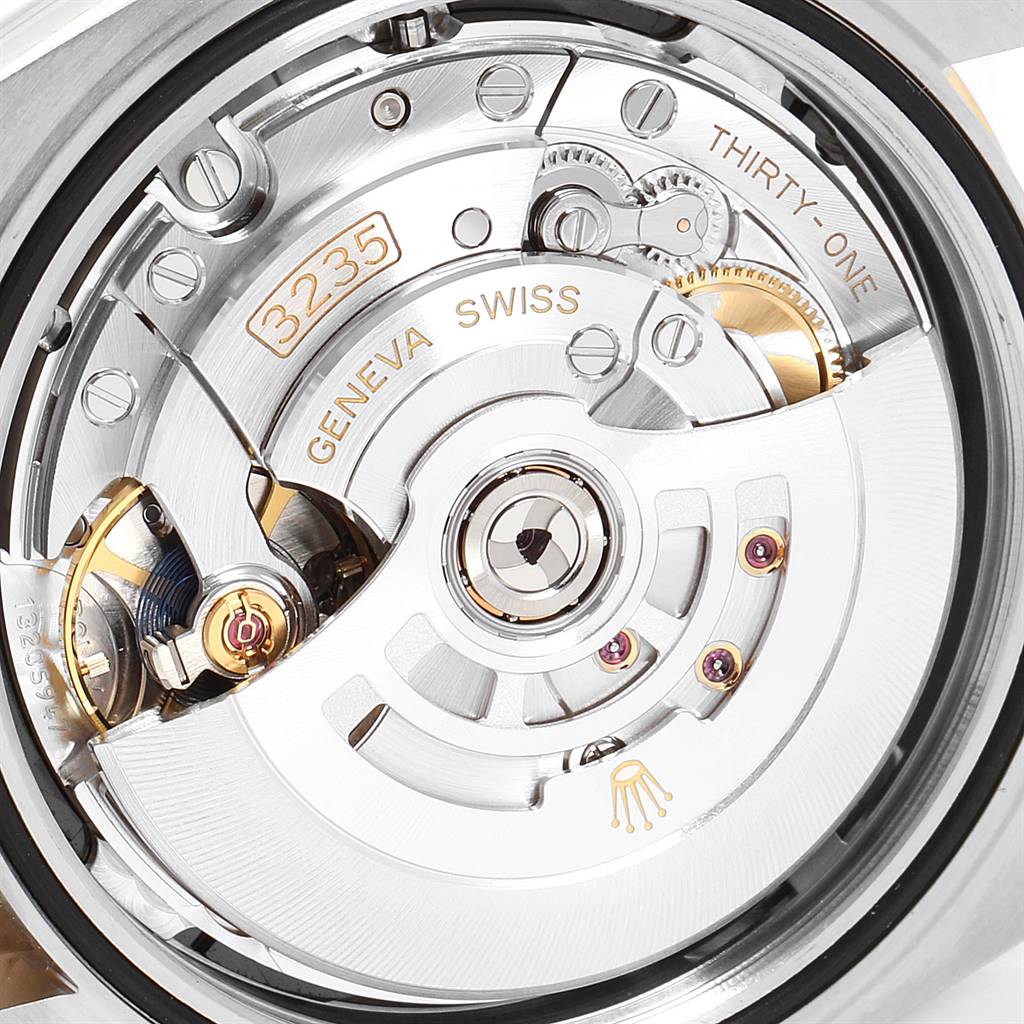The image shows the intricate internal movement of a Rolex Datejust 41 126303 Men's Steel and Gold (two tone) Black Dial 126303 Men's Steel and Gold (two tone) Black Dial watch, specifically the Calibre 3235 mechanism.