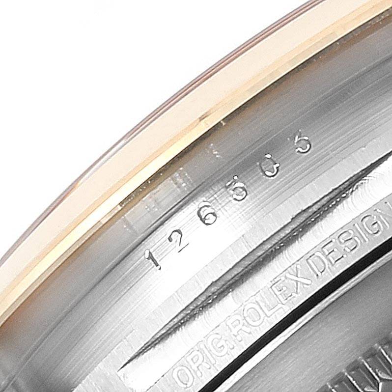 This image shows a close-up of the case back engraving on a Rolex Datejust 41 126303 Men's Steel and Gold (two tone) Black Dial 126303 Men's Steel and Gold (two tone) Black Dial model.