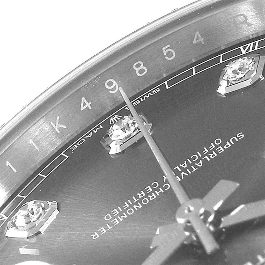 The image focuses on a close-up, angled view of the dial and markers of the Rolex Datejust 41 126334 Men's Stainless Steel Grey Dial 126334 Men's Stainless Steel Grey Dial watch, with visible text and diamond hour markers.