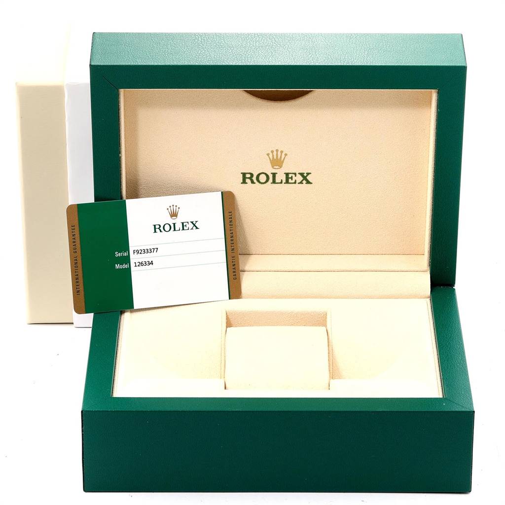 This image shows the open box of a Rolex Datejust 41 126334 Men's Stainless Steel Black Dial 126334 Men's Stainless Steel Black Dial, featuring the guarantee card and watch holder.