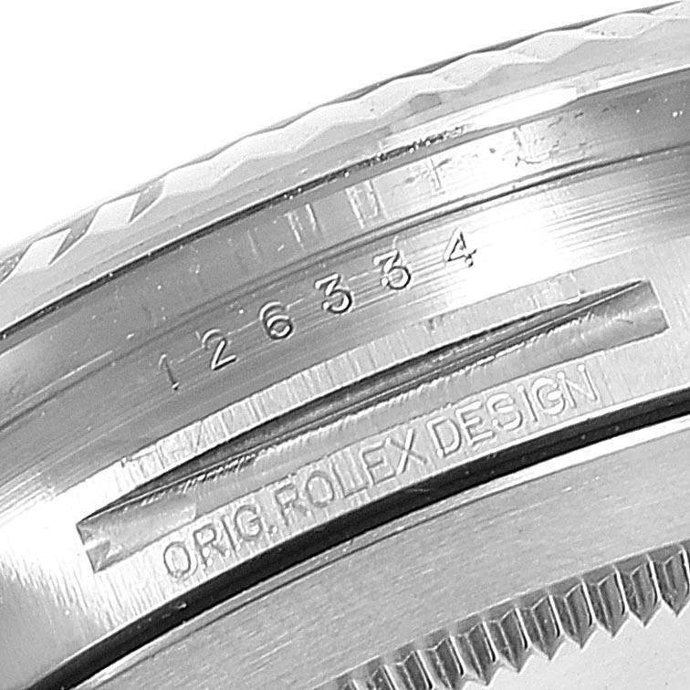 This close-up image displays the side engraving and part of the fluted bezel on a Rolex Datejust 41 126334 Men's Stainless Steel Black Dial 126334 Men's Stainless Steel Black Dial model.
