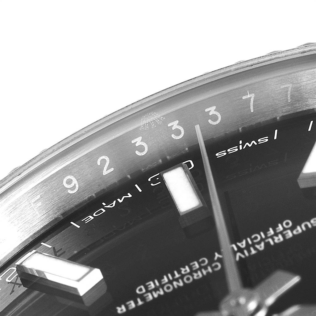 The image shows a close-up view of the Rolex Datejust 41 126334 Men's Stainless Steel Black Dial 126334 Men's Stainless Steel Black Dial watch dial, focusing on the hour markers, text, and part of the bezel.