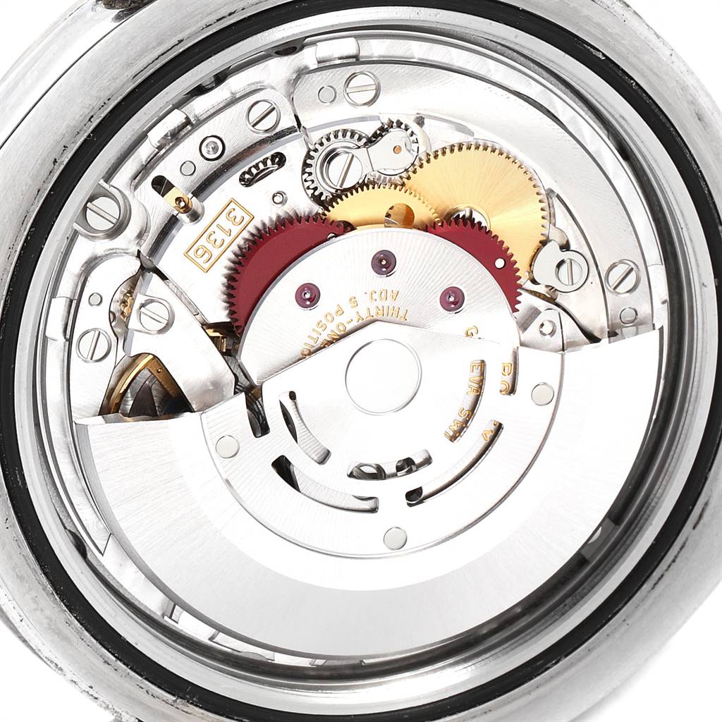 This is a close-up view of the movement mechanism of a Rolex Datejust 41 116334 Men's Stainless Steel Silver Dial 116334 Men's Stainless Steel Silver Dial watch, showing gears and intricate details.