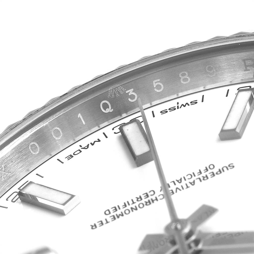 This close-up view of the Rolex Datejust 41 126334 Men's Stainless Steel White Dial 126334 Men's Stainless Steel White Dial showcases the edge of the dial and some of the hour markers.