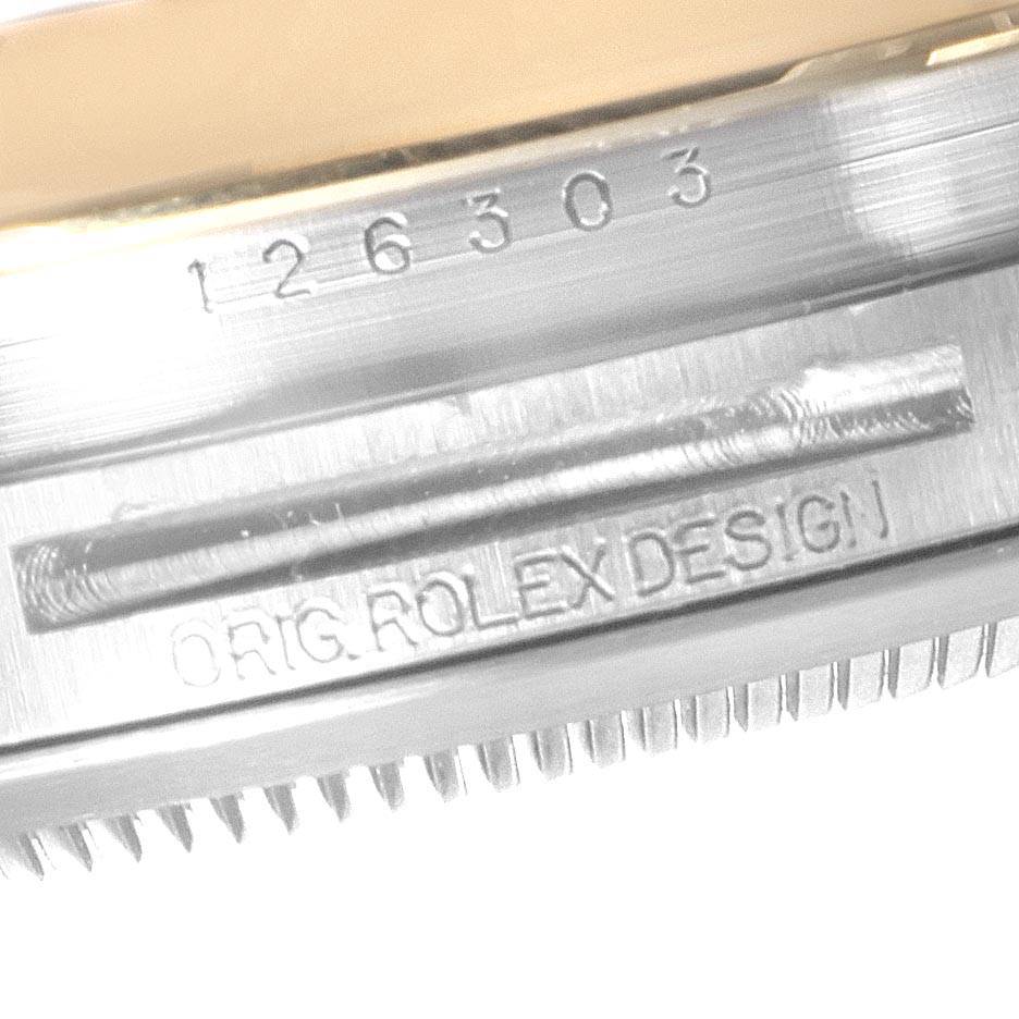 The image shows a close-up of the side of a Rolex Datejust 41 126303 Men's Steel and Gold (two tone) Black Dial 126303 Men's Steel and Gold (two tone) Black Dial with the model number and "ORIG. ROLEX DESIGN" engraving.