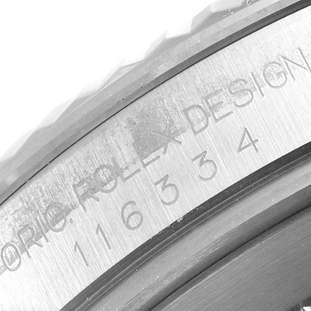 The image shows a close-up side angle of the bezel and casing of a Rolex Datejust 41 116334 Men's Stainless Steel Blue Dial 116334 Men's Stainless Steel Blue Dial model, highlighting the engraved details.