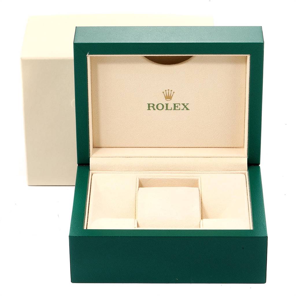 This image shows the open display box for a Rolex Datejust 41 126300 Men's Stainless Steel Grey Dial 126300 Men's Stainless Steel Grey Dial watch, featuring a green exterior and beige interior.