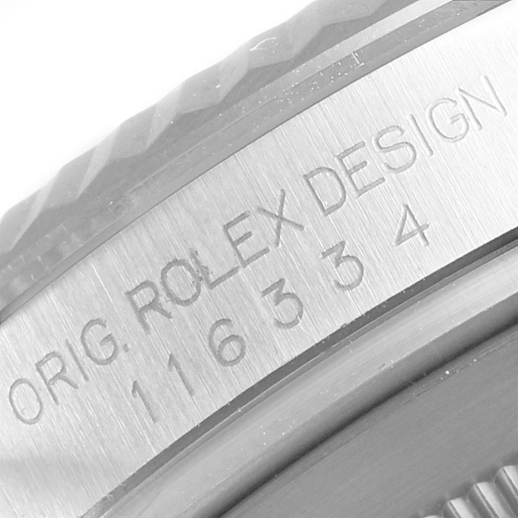 This image shows a close-up angle of the engraved case back and bezel of a Rolex Datejust 41 116334 Men's Stainless Steel Silver Dial 116334 Men's Stainless Steel Silver Dial model.