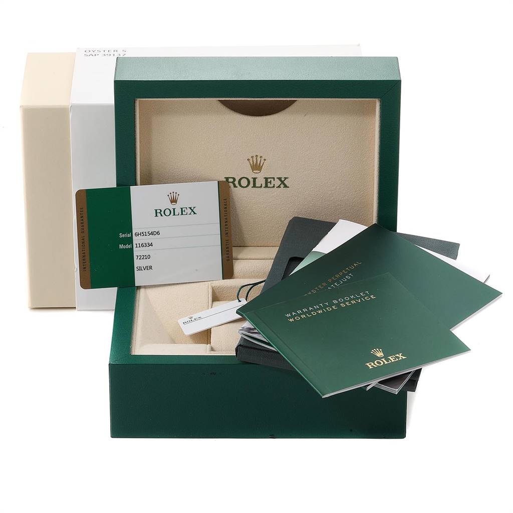 The image shows the packaging and accessories for a Rolex Datejust 41 116334 Men's Stainless Steel Silver Dial 116334 Men's Stainless Steel Silver Dial, including the box, warranty card, and booklets.