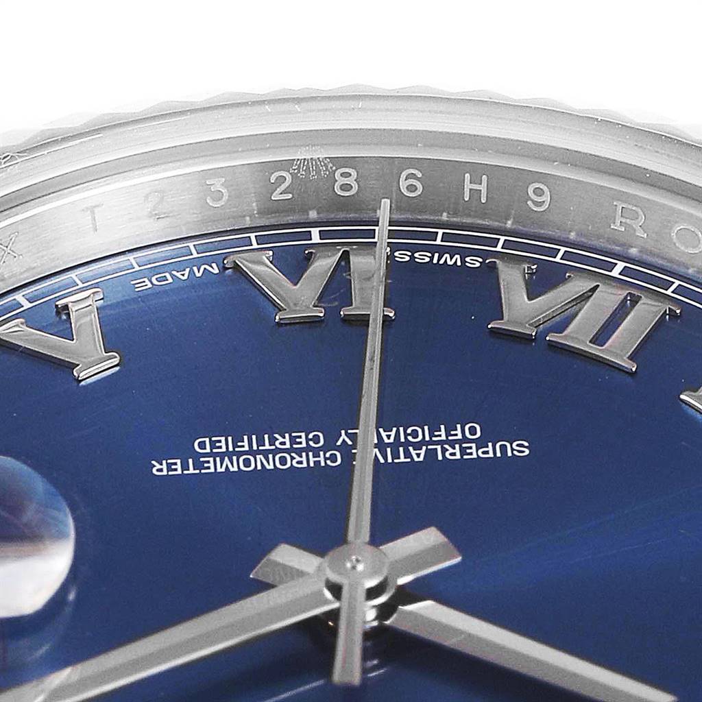The image shows a close-up of the dial and bezel of a Rolex Datejust 41 116334 Men
s Stainless Steel Blue Dial 116334 Men
s Stainless Steel Blue Dial watch, highlighting the Roman numerals and central hands.