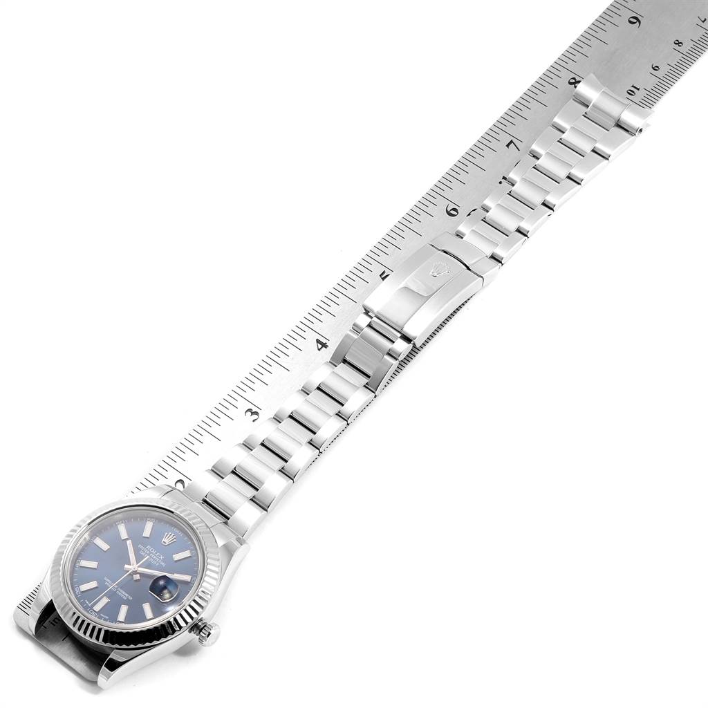 The image shows a top-down view of a Rolex Datejust 41 116334 Men's Stainless Steel Blue Dial 116334 Men's Stainless Steel Blue Dial, including its face, bracelet, and clasp, with a ruler for scale.