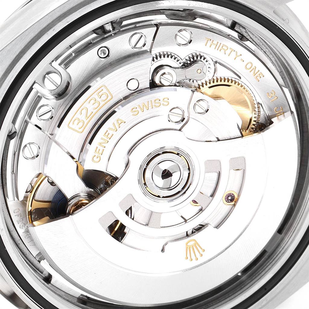 This image shows a close-up of the movement mechanism of the Rolex Datejust 41 126344 Men's Stainless Steel Grey Dial 126344 Men's Stainless Steel Grey Dial, highlighting the intricate gears and parts.