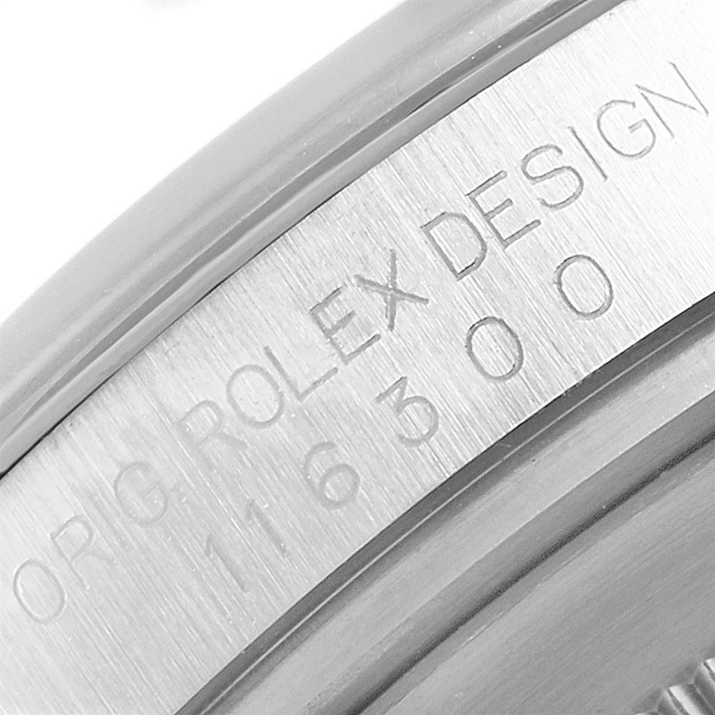 This image shows a close-up of the engraved inner bezel of a Rolex Datejust 41 116300 Men's Stainless Steel Silver Dial 116300 Men's Stainless Steel Silver Dial watch.