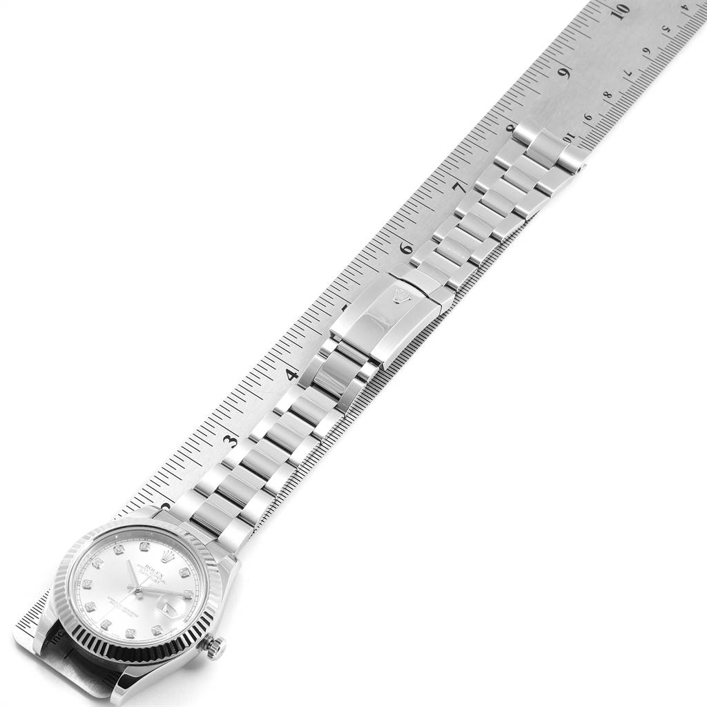 A Datejust 41 model watch by Rolex, shown from the top, includes the face, bracelet, and part of a ruler for scale.