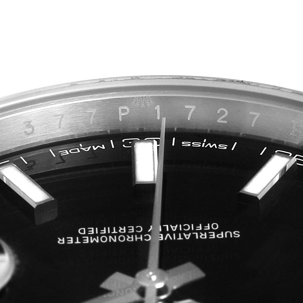 This image shows a close-up of the dial and markers of a Rolex Datejust 41 126300 Men's Stainless Steel Black Dial 126300 Men's Stainless Steel Black Dial watch, highlighting parts of the bezel and hands.
