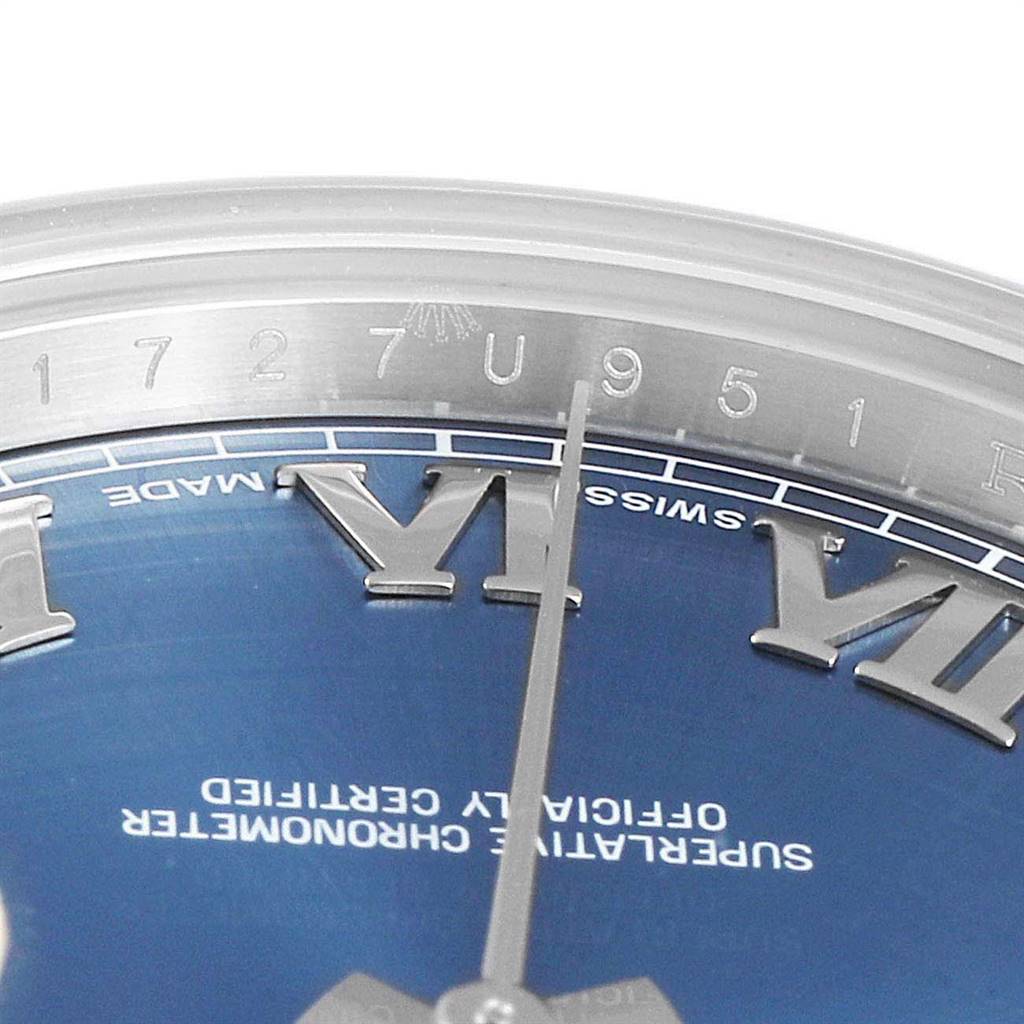 This image shows a partial close-up of the dial, indices, and text on the Rolex Datejust 41 116300 Men's Stainless Steel Blue Dial 116300 Men's Stainless Steel Blue Dial watch.