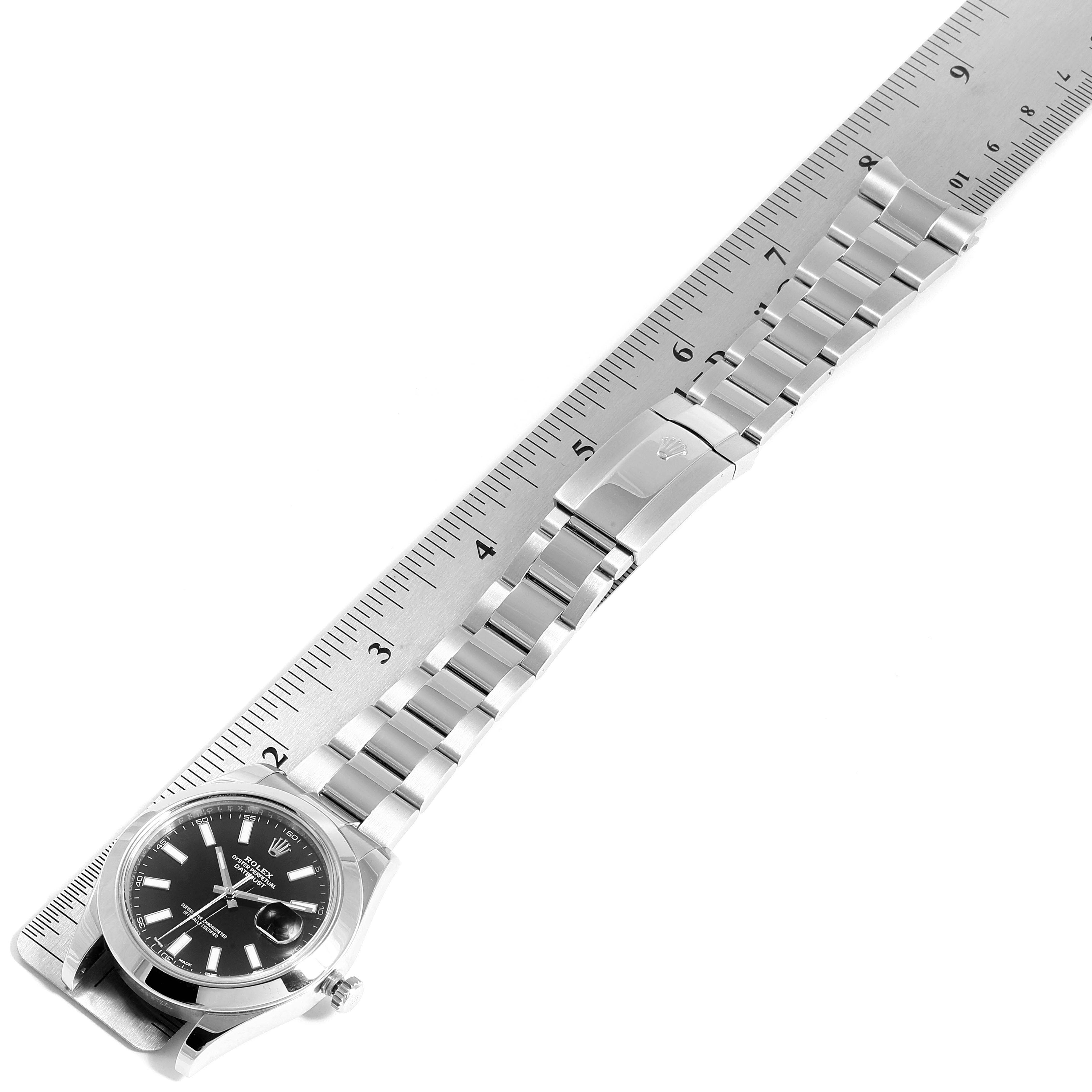 The image shows the Rolex Datejust 41 116300 Men's Stainless Steel Black Dial 116300 Men's Stainless Steel Black Dial watch laid flat, highlighting the bracelet and clasp against a ruler for scale.