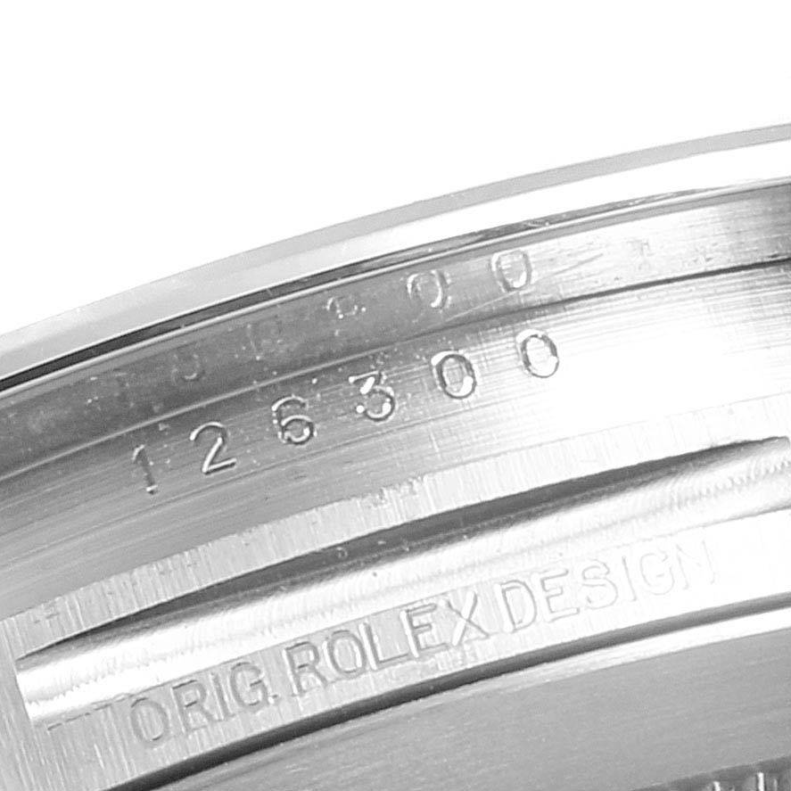 This image shows the inner bezel of a Rolex Datejust 41 126300 Men's Stainless Steel Blue Dial 126300 Men's Stainless Steel Blue Dial, featuring the model number 126300 and engraving "ORIG. ROLEX DESIGN."