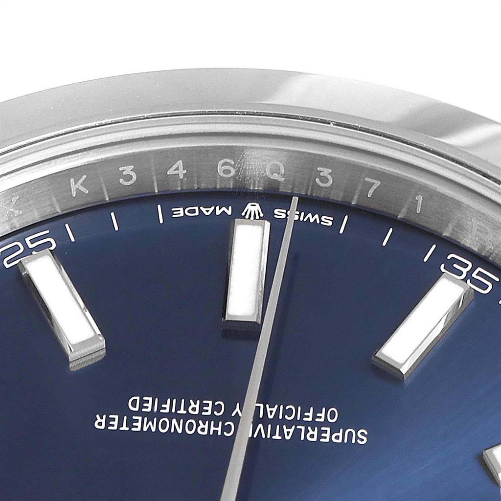 The image shows a close-up of the dial and part of the bezel of a Rolex Datejust 41 126300 Men's Stainless Steel Blue Dial 126300 Men's Stainless Steel Blue Dial watch with a blue face.