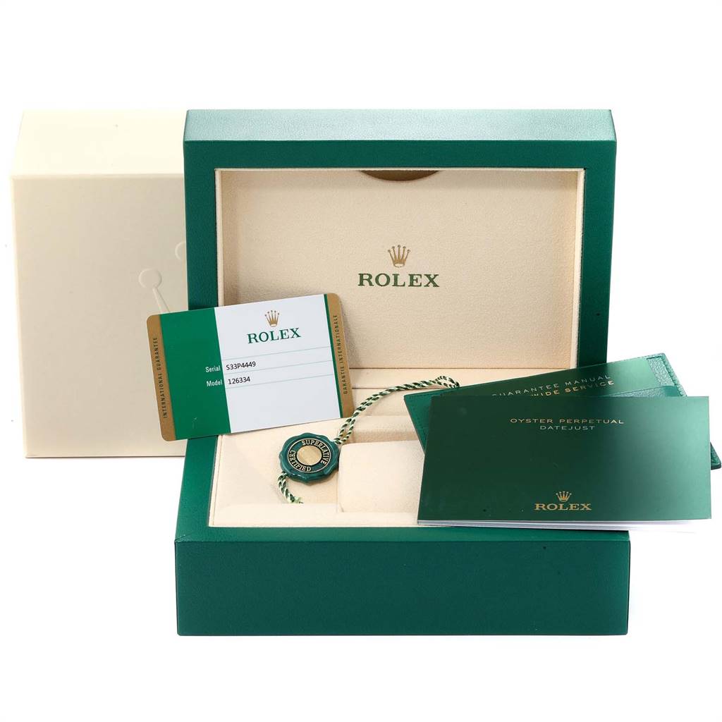 The image shows a Rolex Datejust 41 126334 Men's Stainless Steel Blue Dial 126334 Men's Stainless Steel Blue Dial box with warranty cards, tags, and manuals arranged inside and around it.