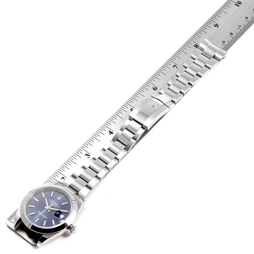 The image shows a Rolex Datejust 41 126300 Men's Stainless Steel Blue Dial 126300 Men's Stainless Steel Blue Dial watch laid flat with a ruler measuring its bracelet length.