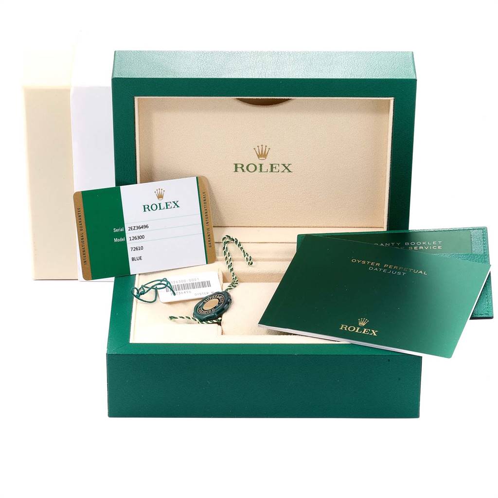 The image shows the Rolex Datejust 41 126300 Men's Stainless Steel Blue Dial 126300 Men's Stainless Steel Blue Dial packaging with booklets, a tag, and a warranty card.