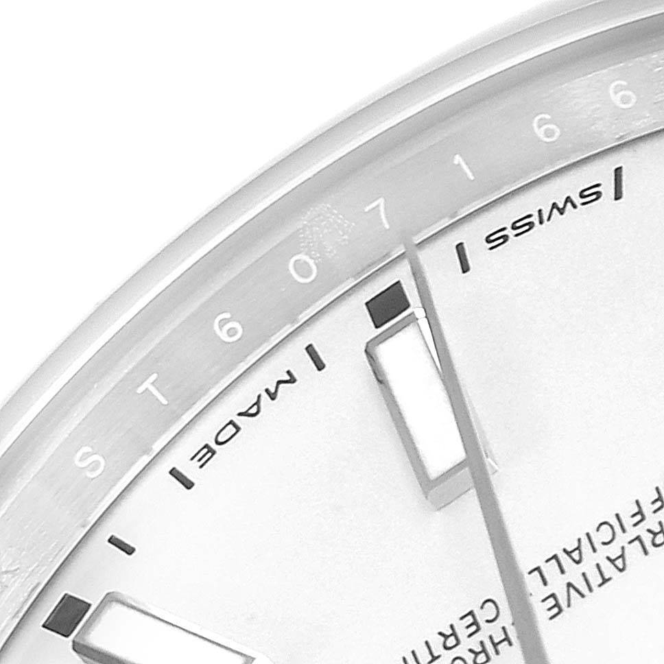 This image shows a close-up of the dial's edge of a Rolex Datejust 41 114300 Men's Stainless Steel White Dial 114300 Men's Stainless Steel White Dial watch, featuring the "Swiss Made" markings and hour indicators.