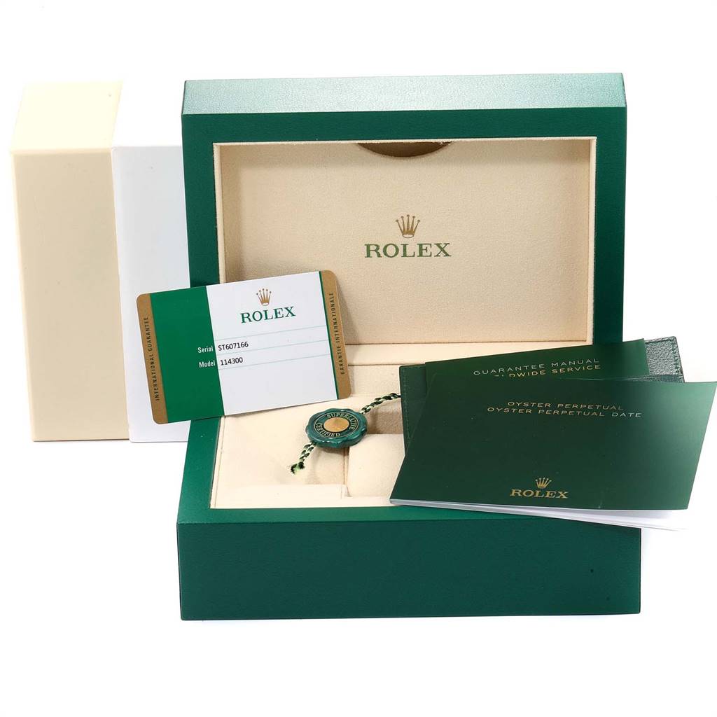 The image shows the packaging, warranty card, manual books, and tag for the Rolex Datejust 41 114300 Men's Stainless Steel White Dial 114300 Men's Stainless Steel White Dial model.