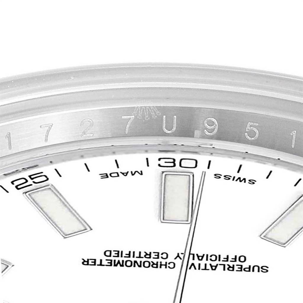 This image of the Rolex Datejust 41 116300 Men's Stainless Steel White Dial 116300 Men's Stainless Steel White Dial shows a close-up of the dial, focusing on the upper part near the 12 o'clock position.