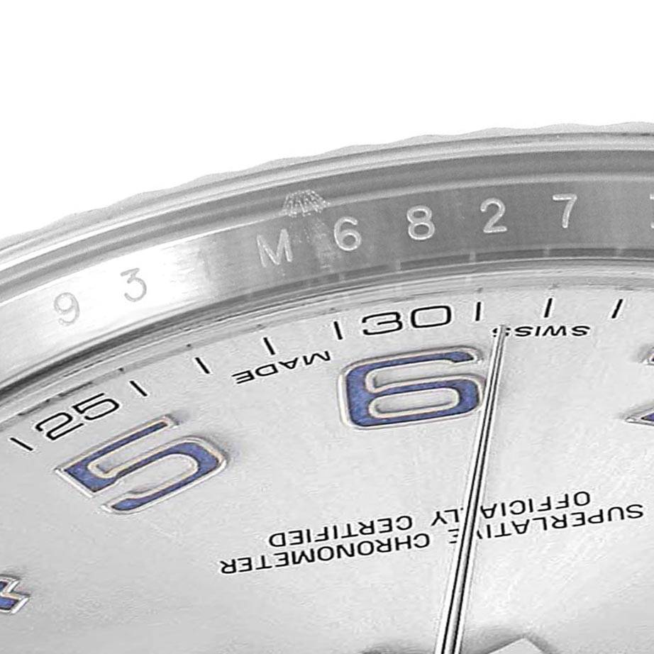 This close-up image of the Rolex Datejust 41 116334 Men's Stainless Steel Silver Dial 116334 Men's Stainless Steel Silver Dial shows parts of the bezel, dial, and hour markers.