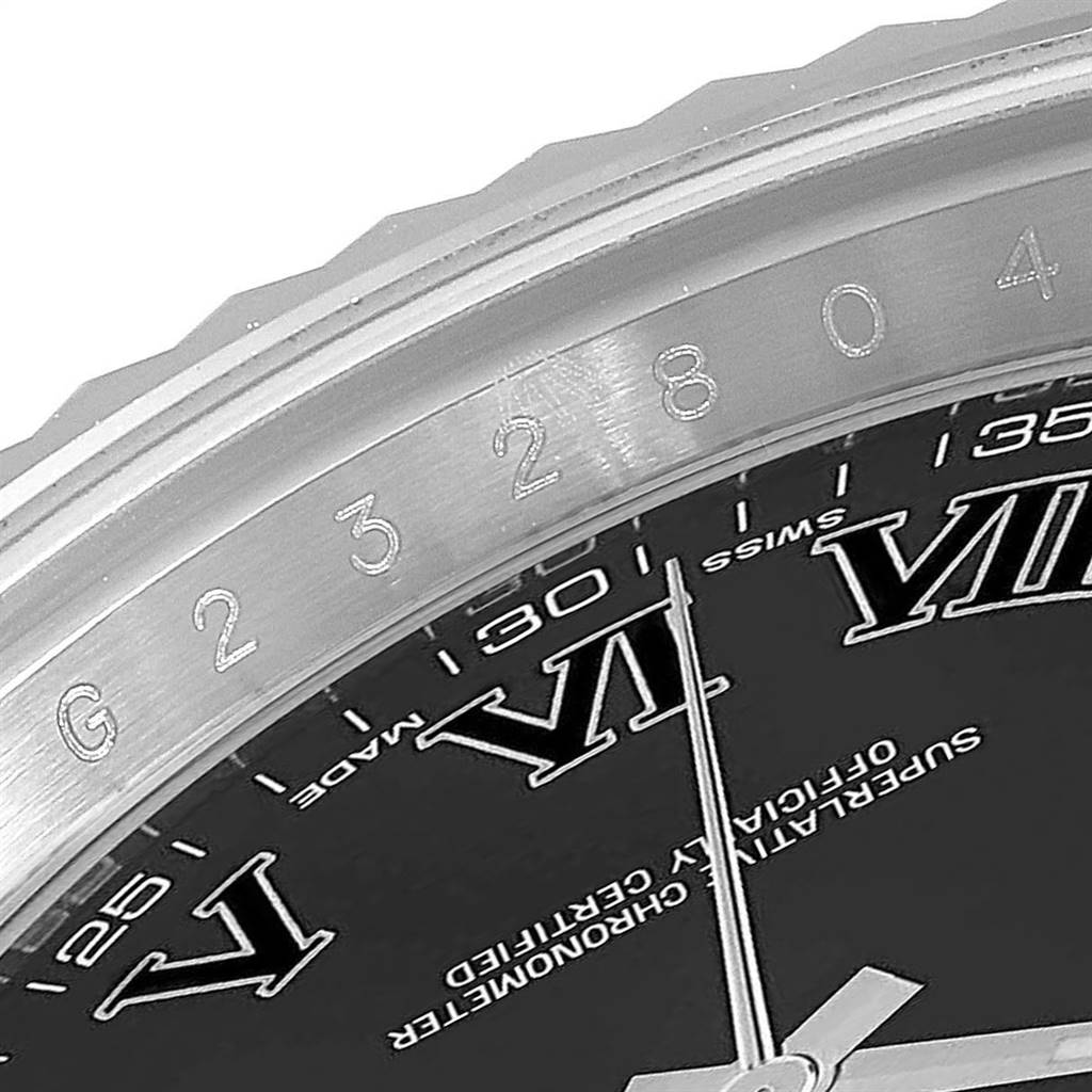 This image shows a close-up of the bezel and part of the dial of a Rolex Datejust 41 116334 Men's Stainless Steel Grey Dial 116334 Men's Stainless Steel Grey Dial watch.