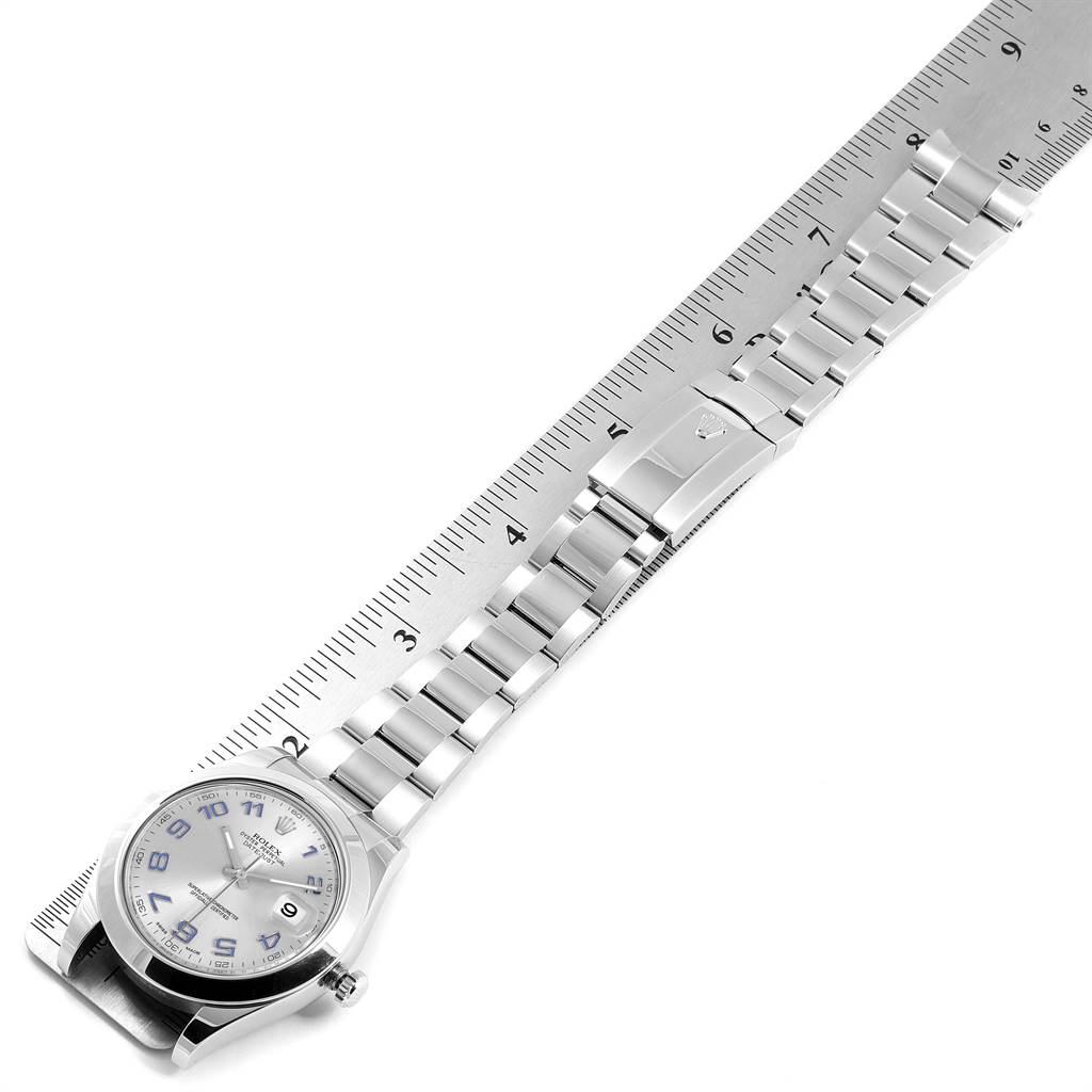 The Rolex Datejust 41 116300 Men's Stainless Steel Silver Dial 116300 Men's Stainless Steel Silver Dial watch is shown from a top-down angle, featuring the watch face, bracelet, and clasp alongside a ruler.