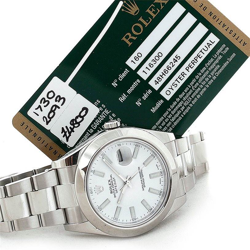 This image shows a Rolex Datejust 41 116300 Men's Stainless Steel White Dial 116300 Men's Stainless Steel White Dial watch from an angled view with the face, bezel, and bracelet visible, alongside its warranty card.
