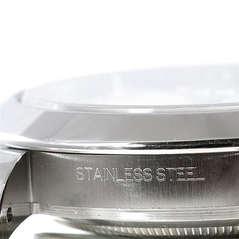 This image shows the side view of the case of a Rolex Datejust 41 116300 Men's Stainless Steel White Dial 116300 Men's Stainless Steel White Dial, highlighting the stainless steel material engraving.